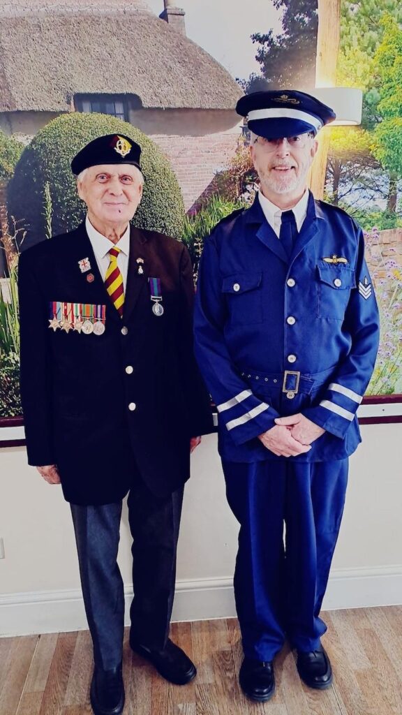 two older men wearing their uniform on VE day celebrations