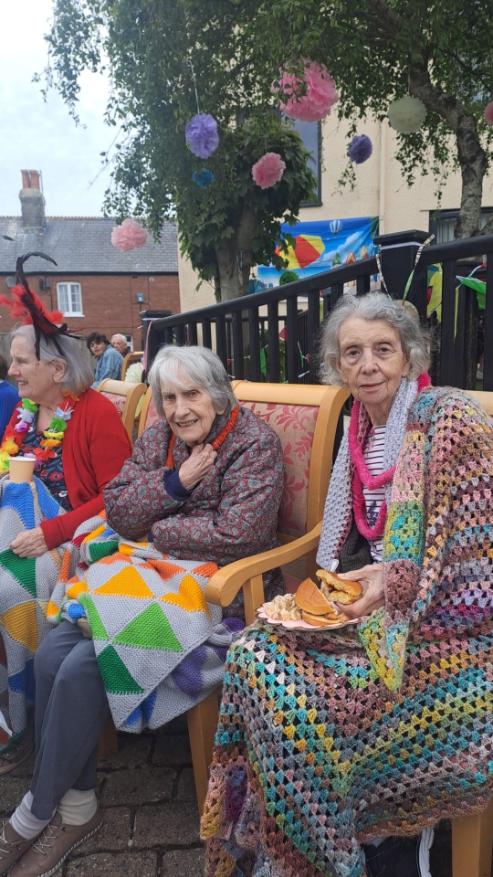 older adults sat down outside